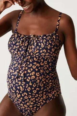 Maternity Printed Scoop Neck Swimsuit 29.50 Marks  Spencer  Why we love it “The tie at the neckline of this swimsuit...