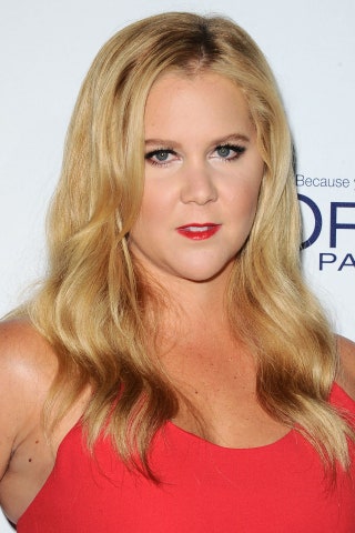 GLAMOUR fave Amy Schumer combined a gorgeous bold red lip with some pretty tousled waves.