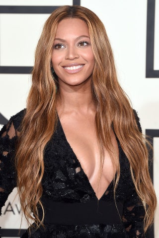 Beyonce shows off the ultimate waved long layers look. Extensions may be wise.