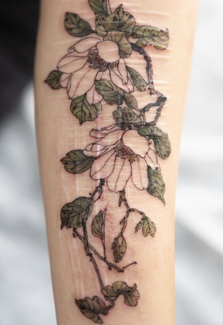 Painted Magnolias tattoo