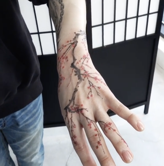 Plum Blossoms hand tattoo